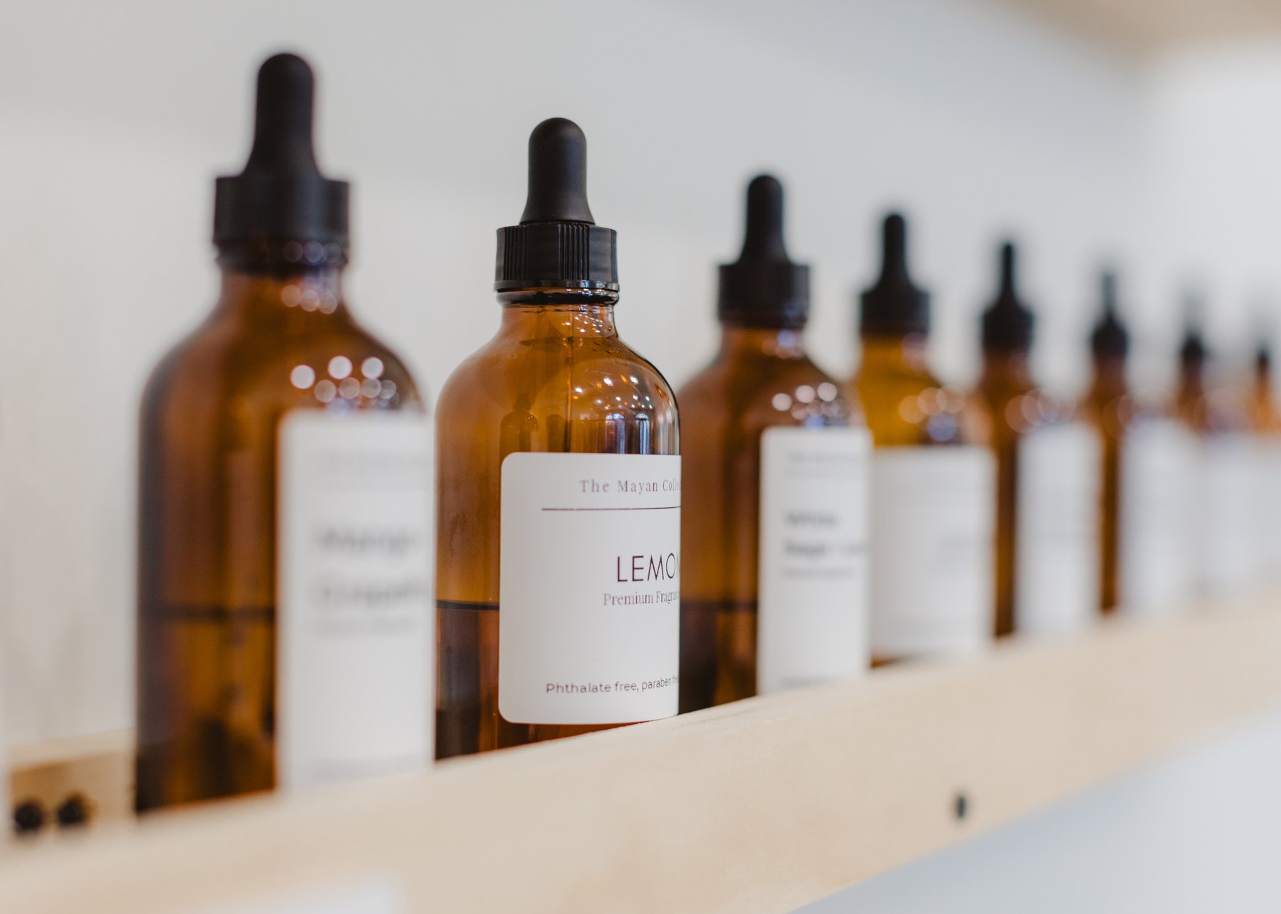 Fragrance oils lined up along the studio blending bar